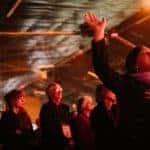 Attendees worshiping at Katoomba Easter Convention in a large tent.